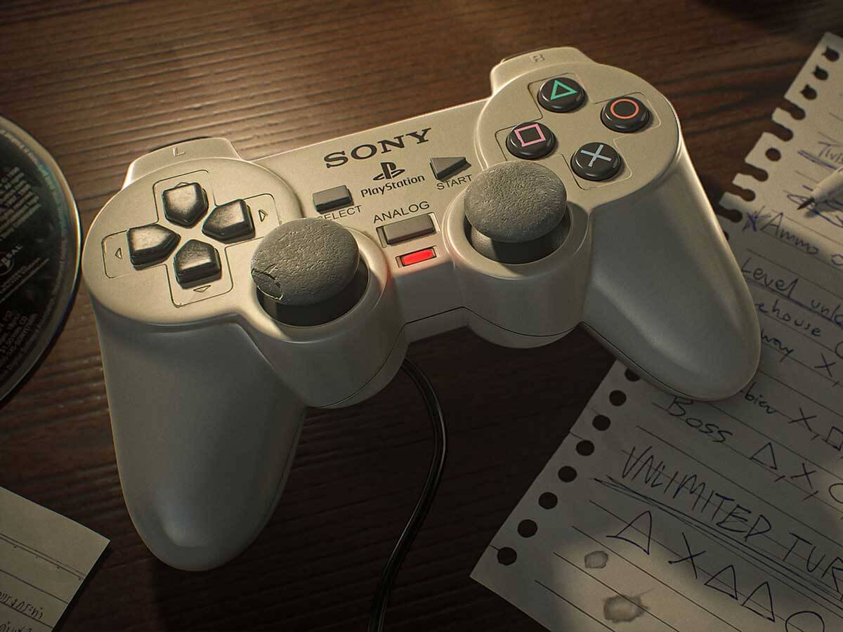 A PlayStation controller next to a paper with written cheat codes.