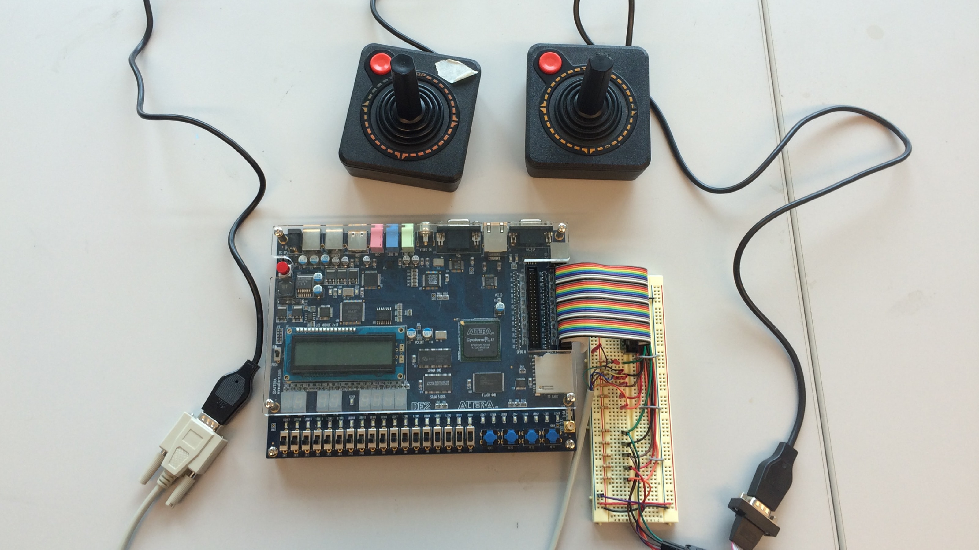 Two Atari joysticks connected to an Altera DE2 board.
