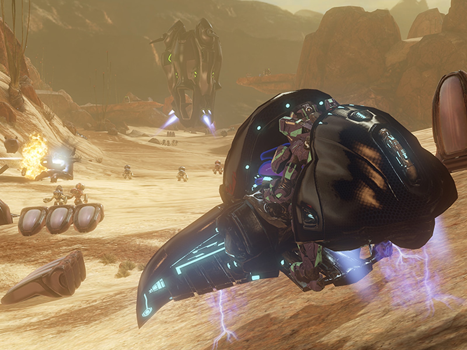 Screenshot from Halo 4 of futuristic machines flying through a mountainous desert