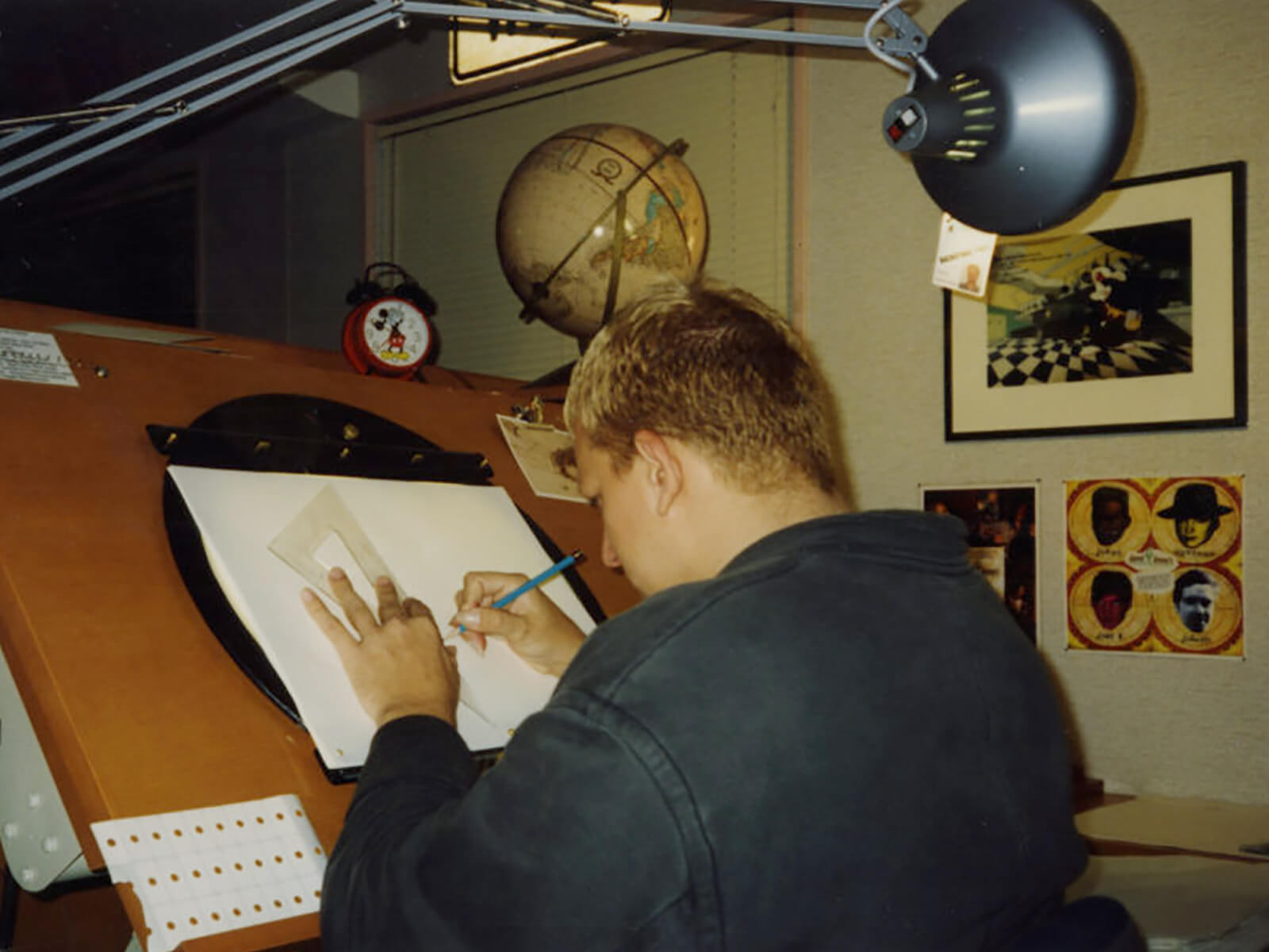 DigiPen BFA director Jazno Francoeur drawing at his desk at Disney Feature Animation Florida