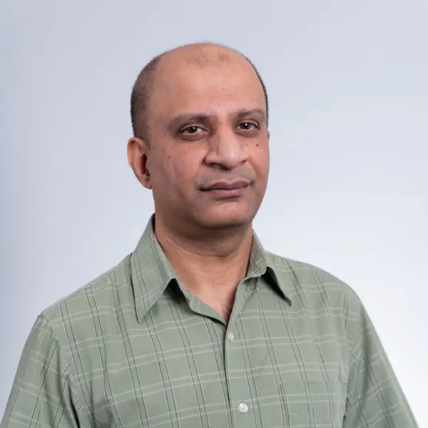 Headshot of Associate Professor Pushpak Karnick.