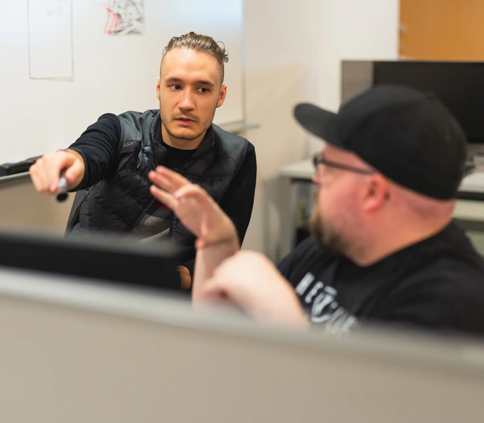 DigiPen students collaborate on a project in a team lab.