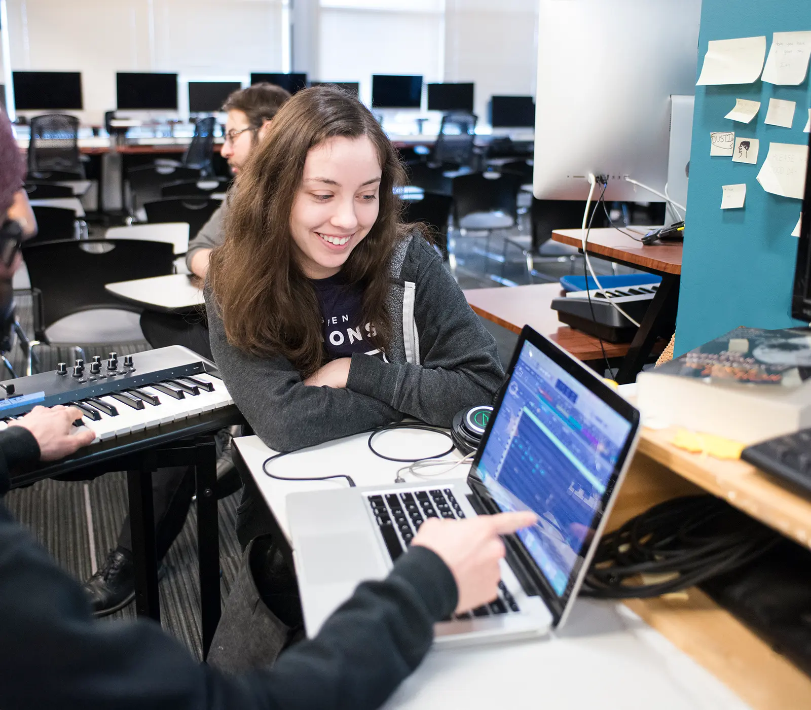 DigiPen students collaborate on a project in a music lab.