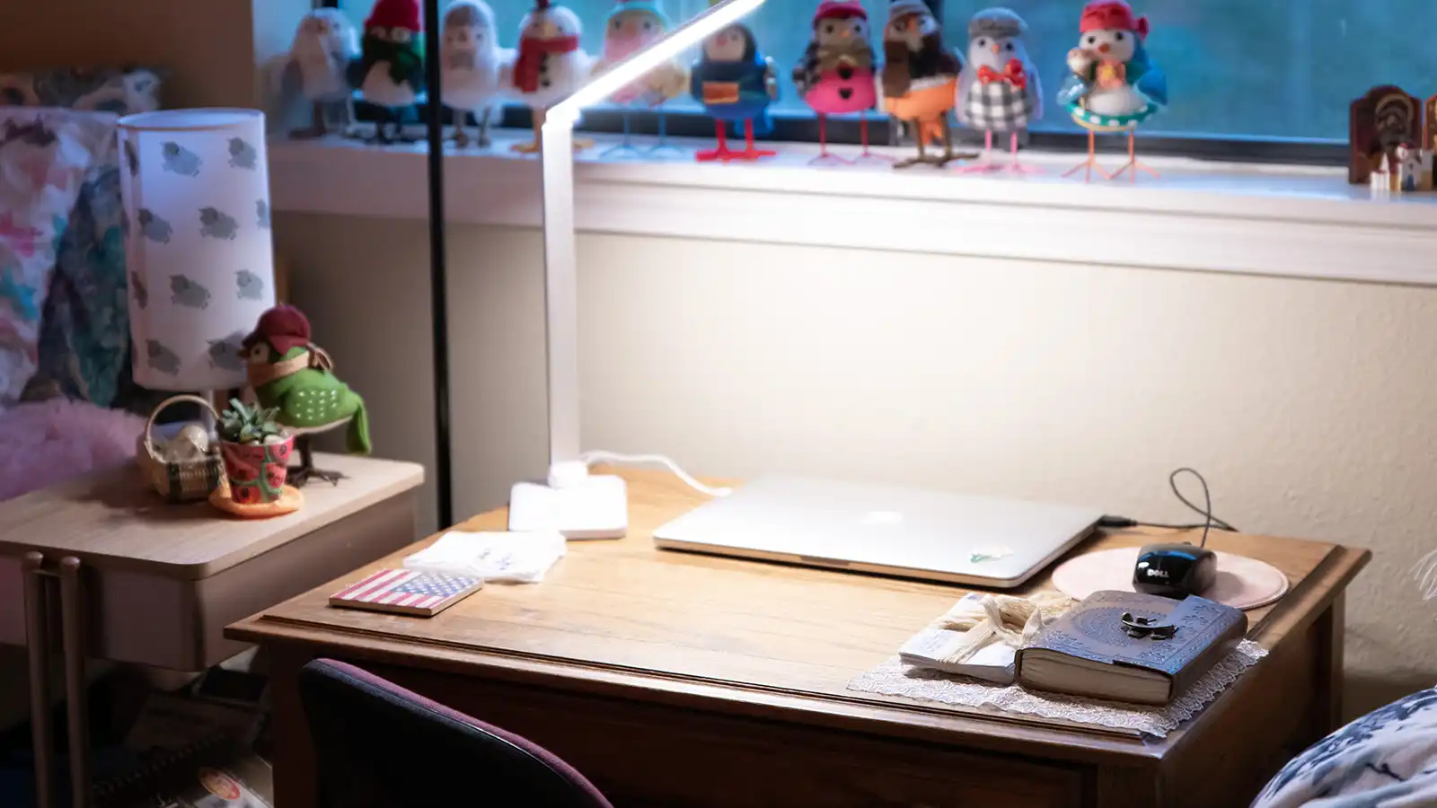 Student desk with various decorations surrounding it.