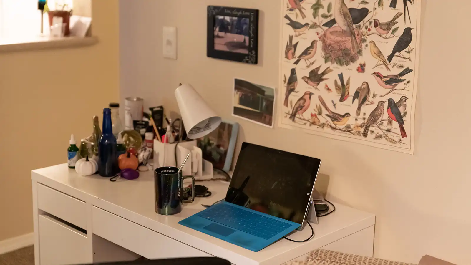 Student desk with a laptop and various accessories.