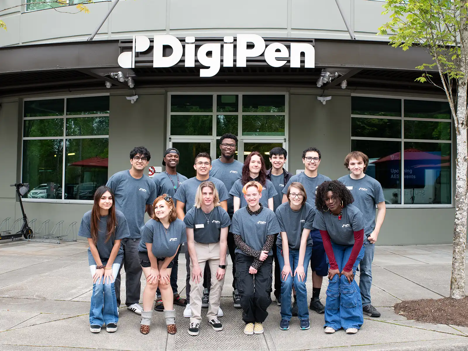 A group of DigiPen RA's pose in front of the campus entrance.