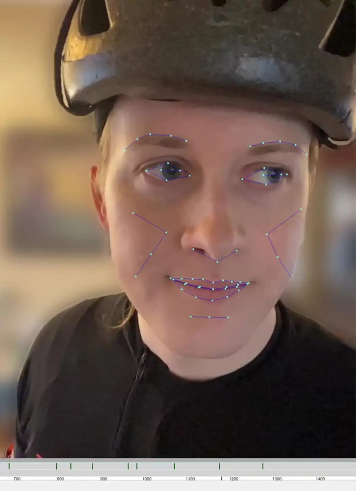 Palfanier wears a helmet with mocap data lines and nodes overlaid onto her facial features.
