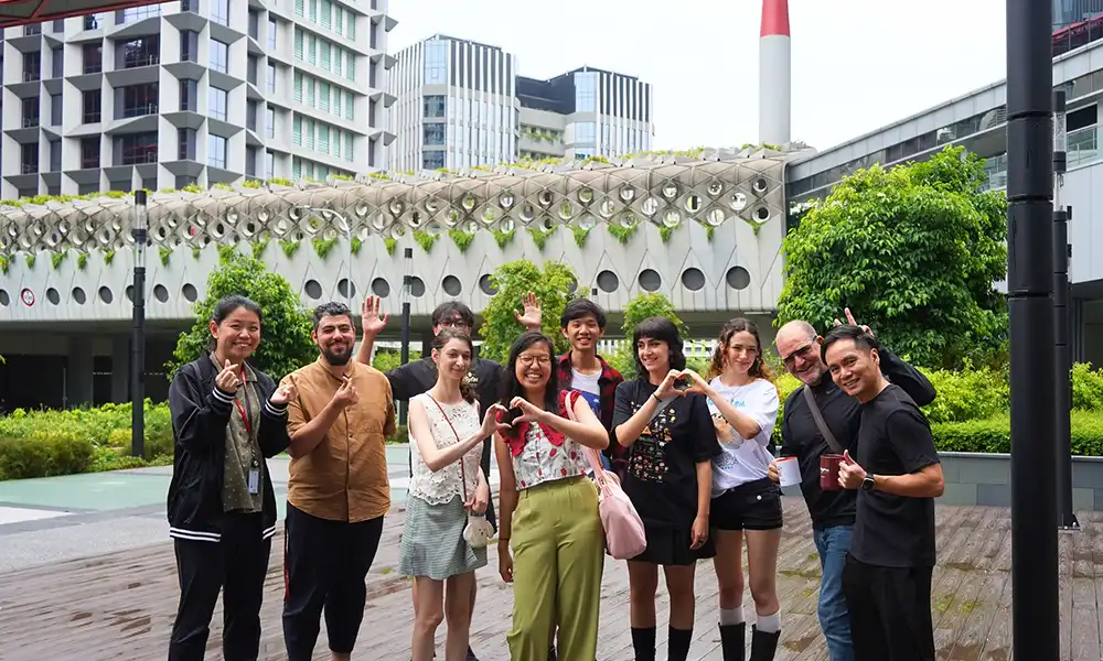 A large group of international students pose.